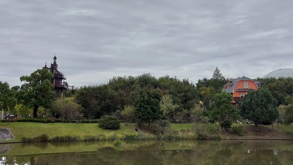 Pond and buildings at the Hill of Youth, Ghibli Park, Nagakute, Aichi