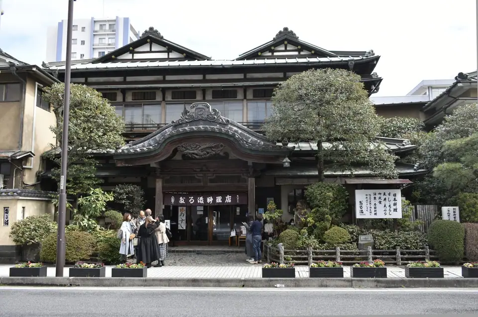 The entrance of Daruma Ryoriten in Odawara, with its curved temple-style gable roof, Odawara, Kanagawa